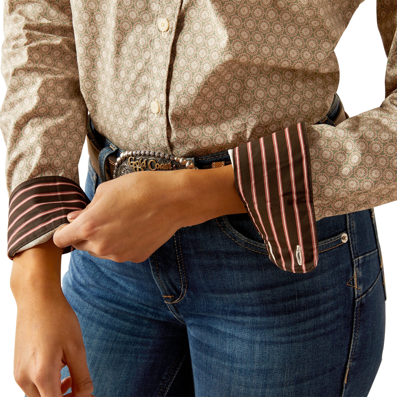 Ariat Women's Wrinkle Resistant Kirby L/S Western Shirt. Person wearing a patterned shirt and jeans with rolled sleeves.