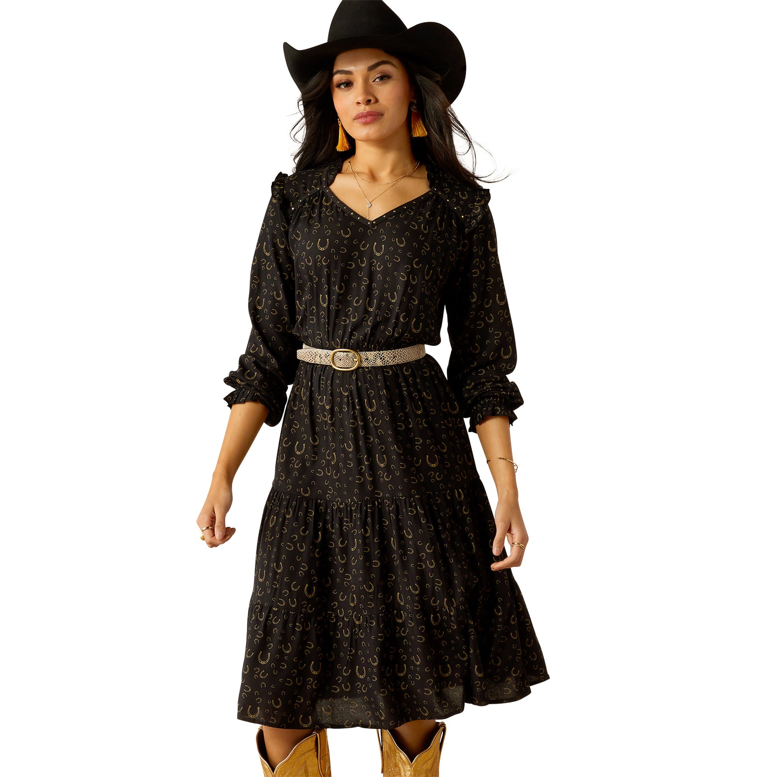 Ariat Women's Blinged Out L/S Western Dress. A woman wearing a long sleeve, floral patterned, black western dress with a belt, and accessories including a cowboy hat and boots.