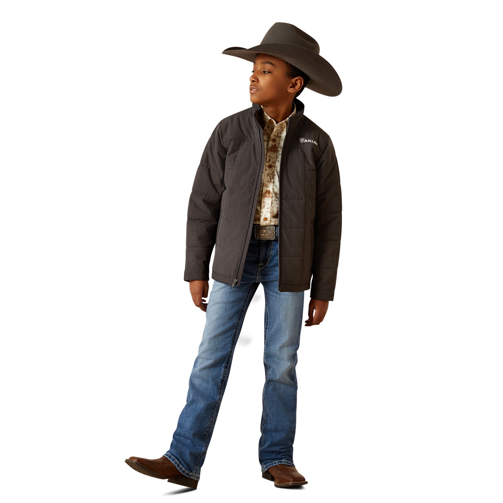 Child wearing a brown jacket, blue jeans, and a cowboy hat on a white background