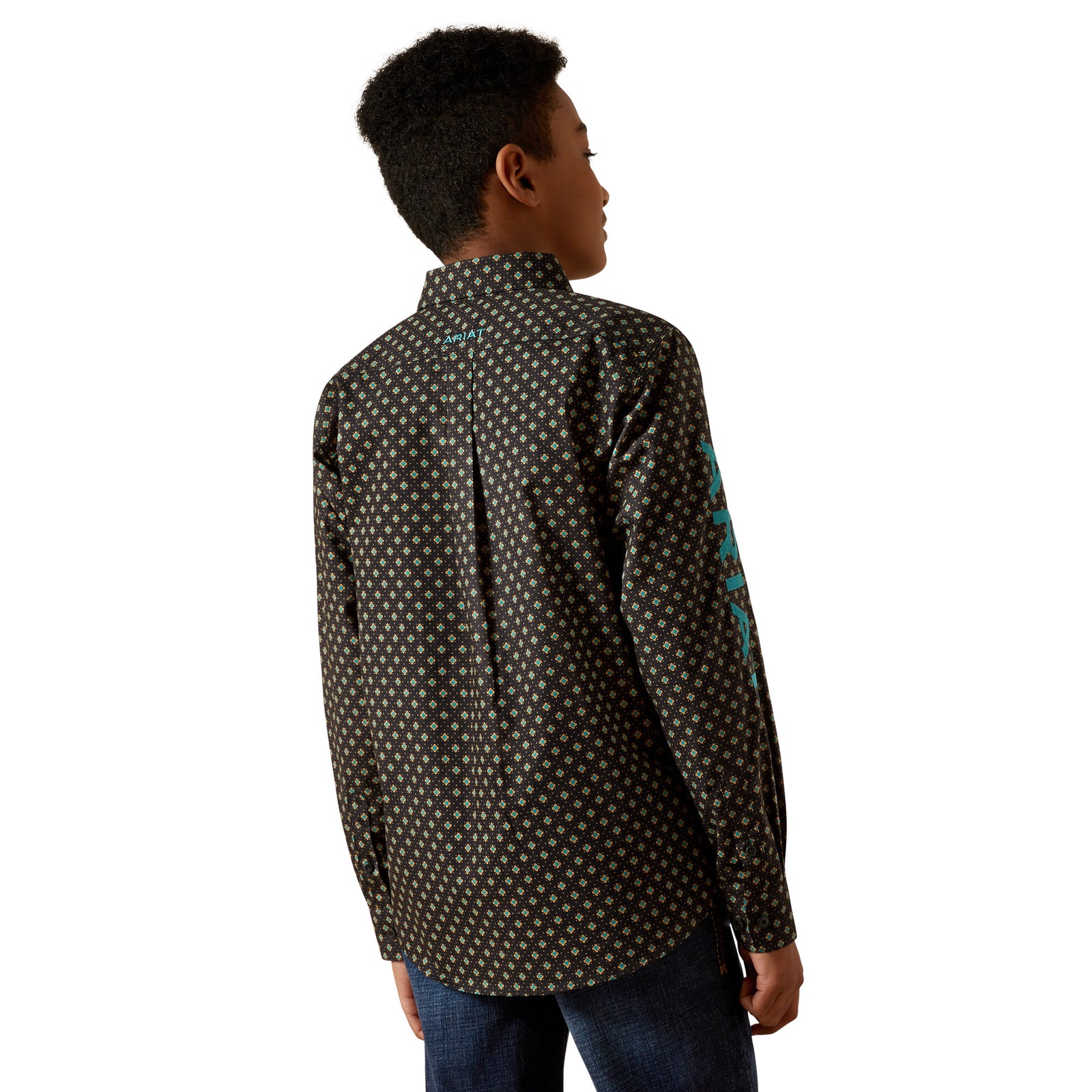 Person wearing a patterned shirt with a white background