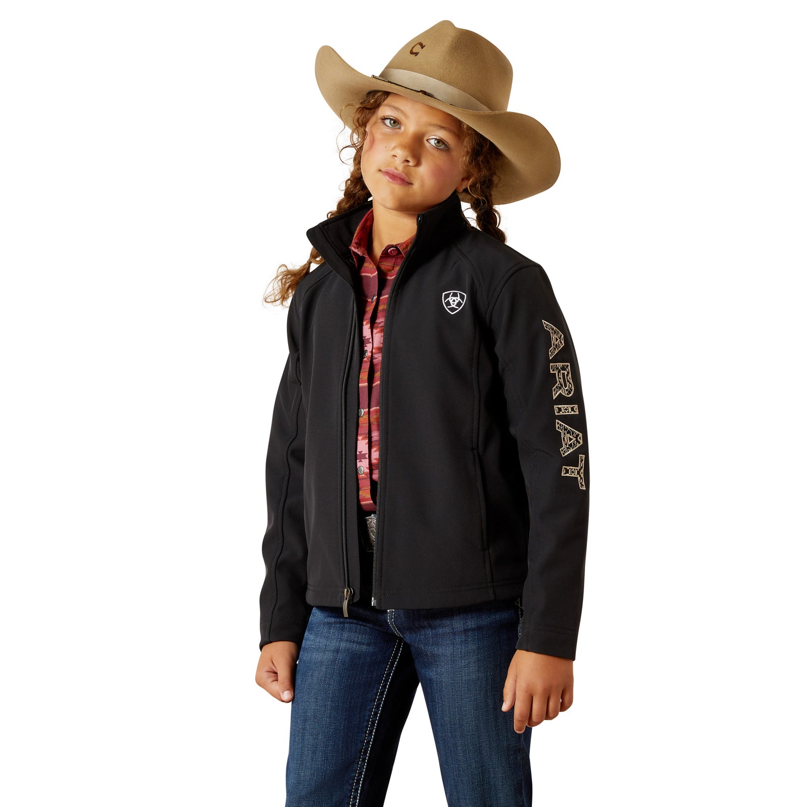 Child wearing a black jacket with a brand logo, blue jeans, and a brown cowboy hat on a white background
