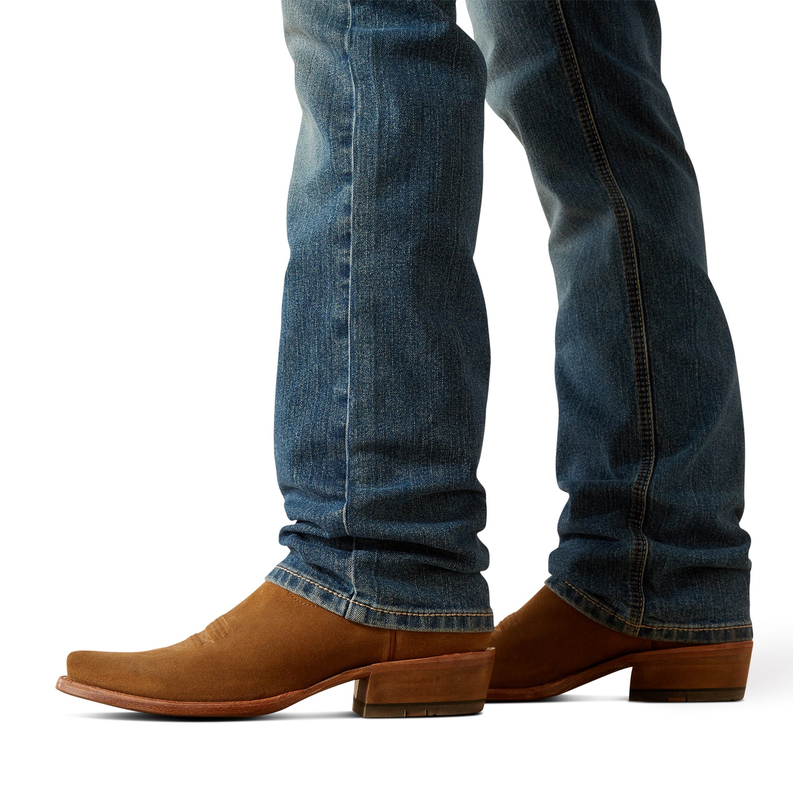 Ariat Men's M7 Jed Straight Leg Jean. Close-up of blue jeans and brown cowboy boots on a white background
