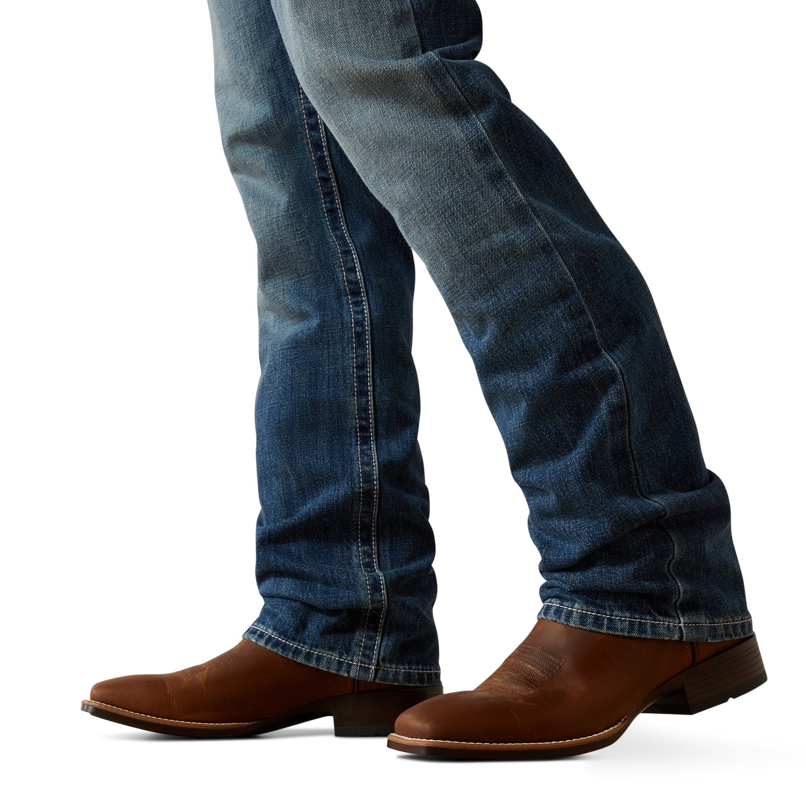 Ariat Men's M4 August Relaxed Straight Leg Jean. Blue jeans and brown boots on a white background