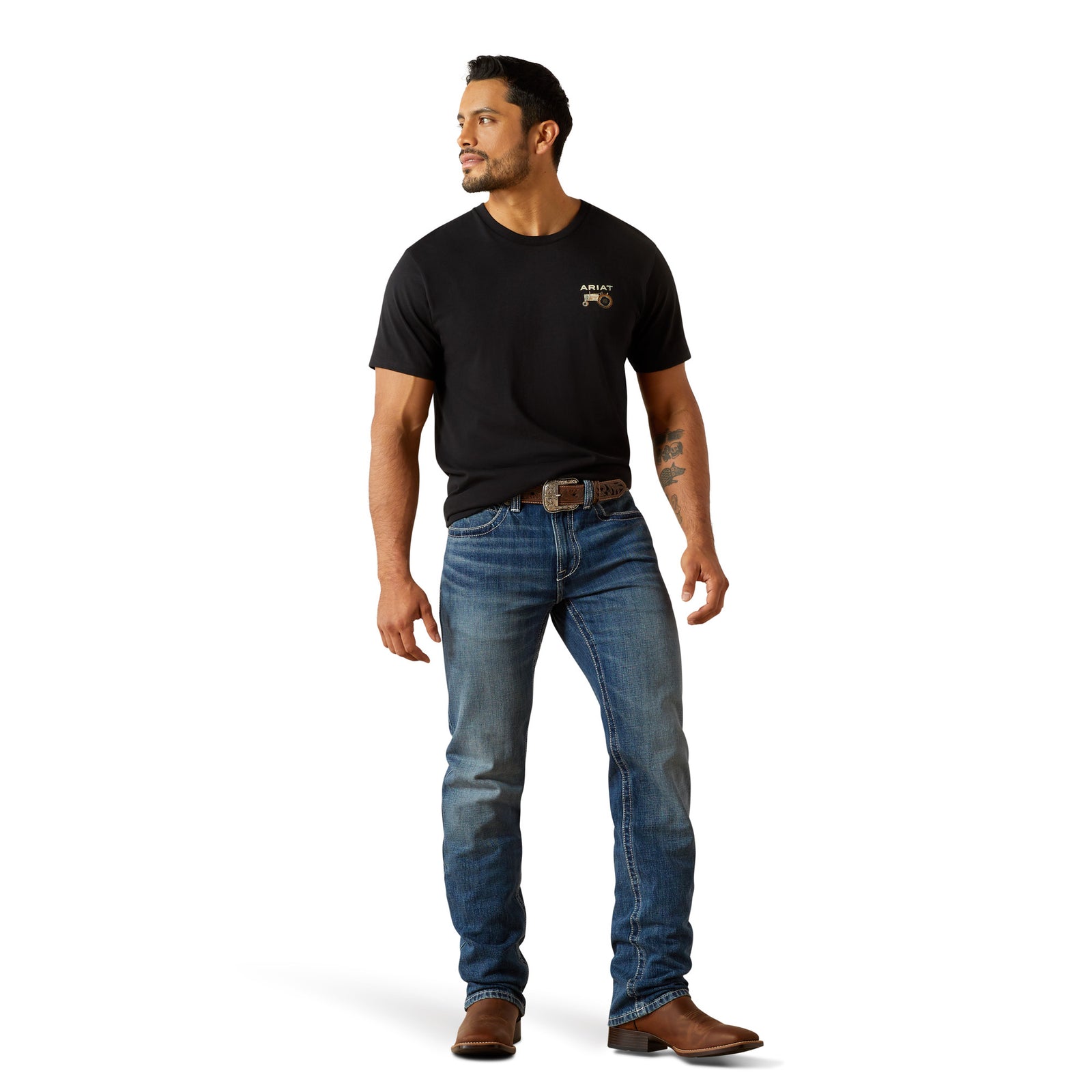 Ariat Men's M4 August Relaxed Straight Leg Jean. Man wearing a black t-shirt and blue jeans on a white background