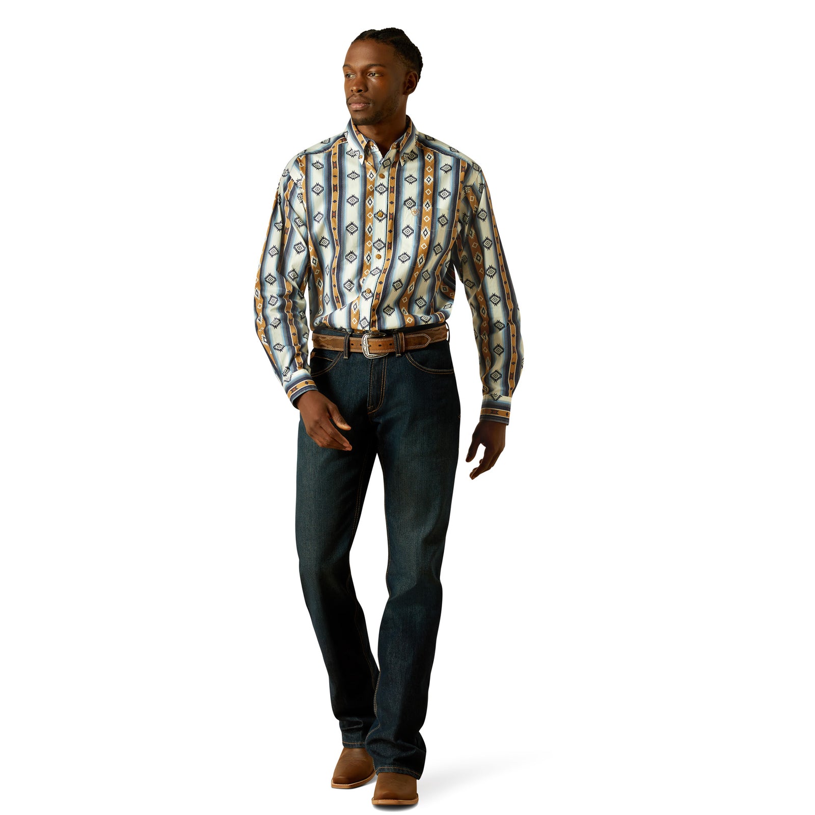 Man wearing a patterned shirt and jeans on a white background