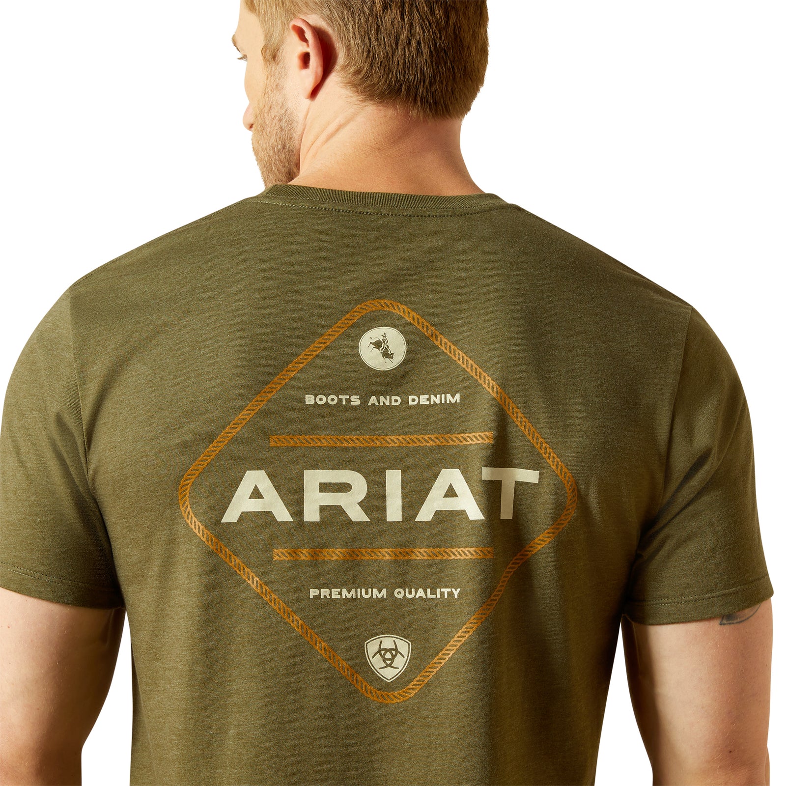 Ariat Men's Roped Diamond T-ShirtMan wearing an olive green Ariat t-shirt with branding on the back.