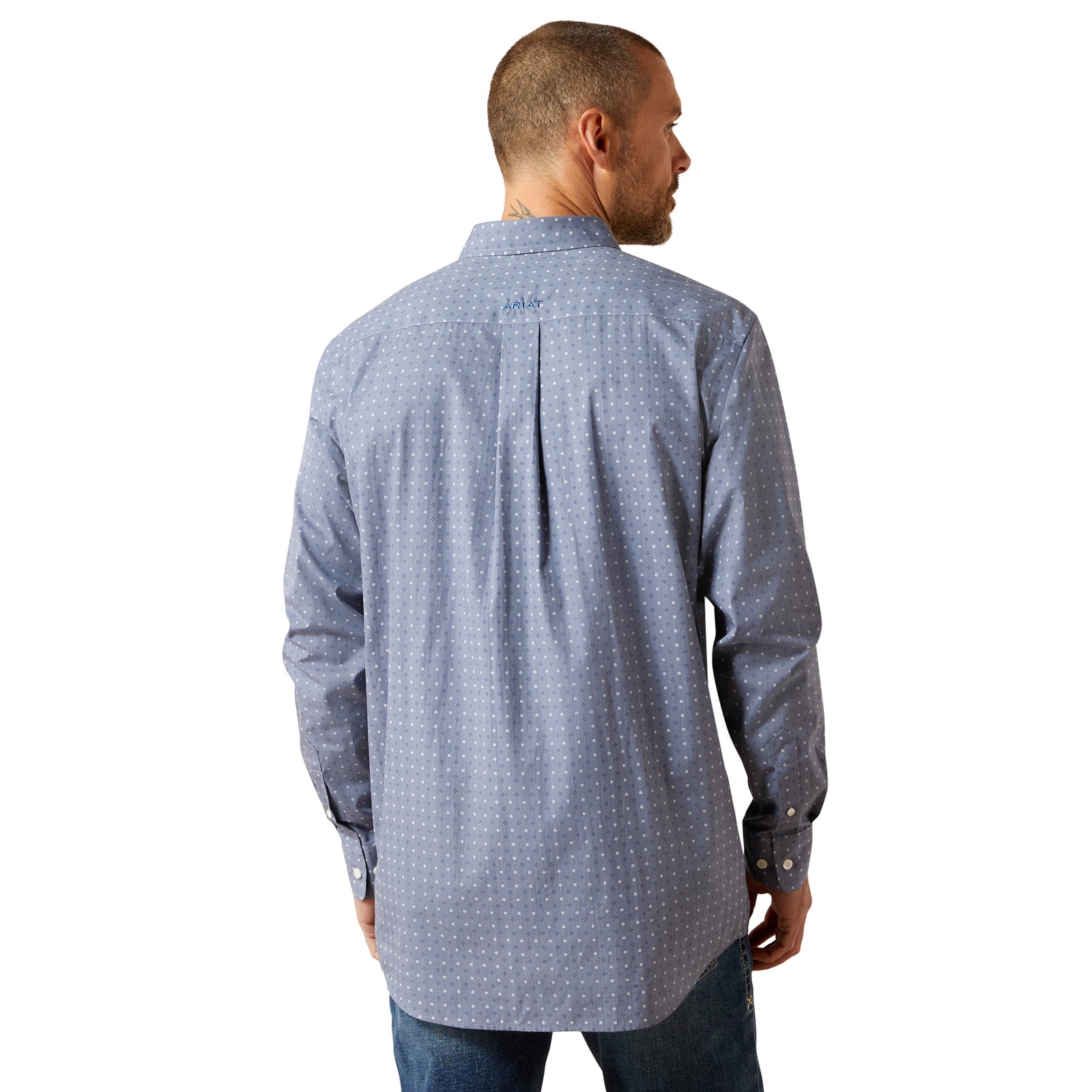 Man wearing a blue patterned shirt on a white background