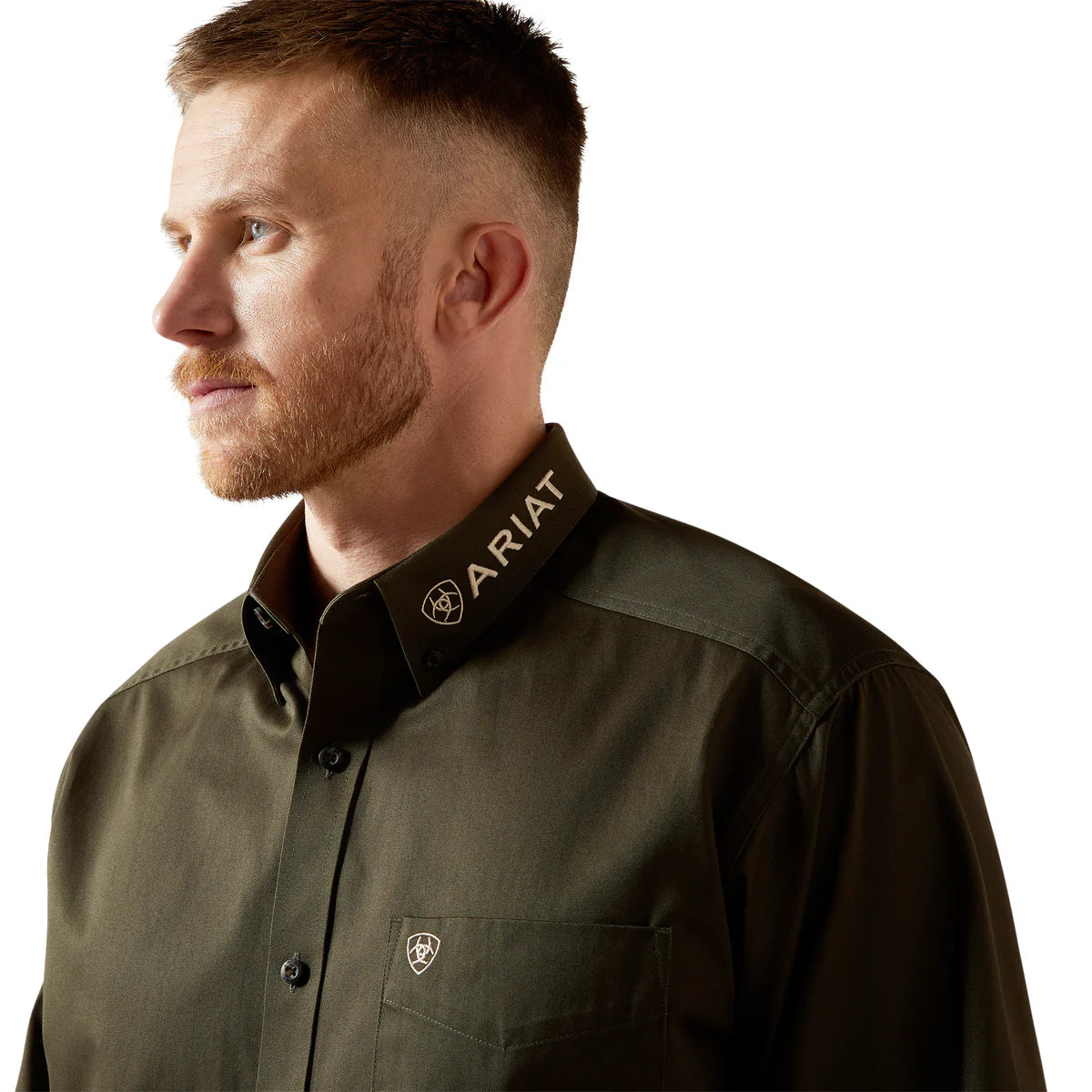 Man wearing a green Ariat shirt with a white background