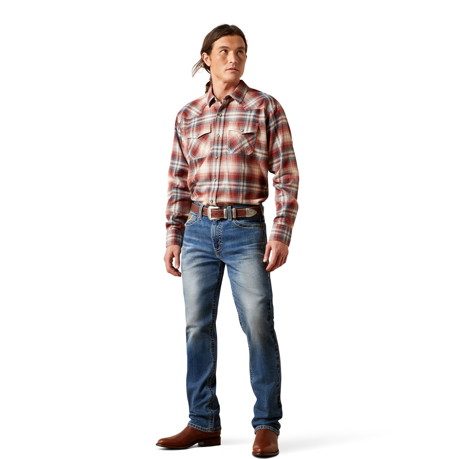 Man wearing a plaid shirt and jeans on a white background