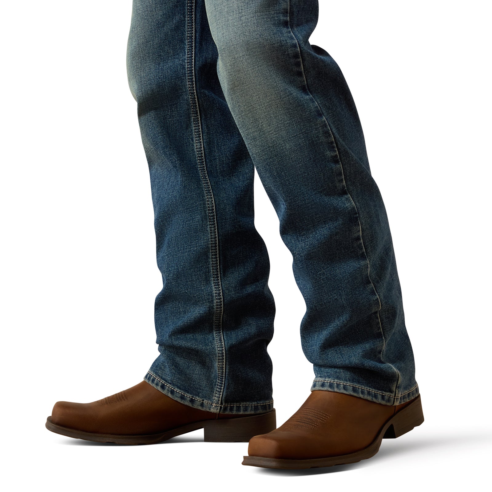 Blue jeans and brown boots on a white background
