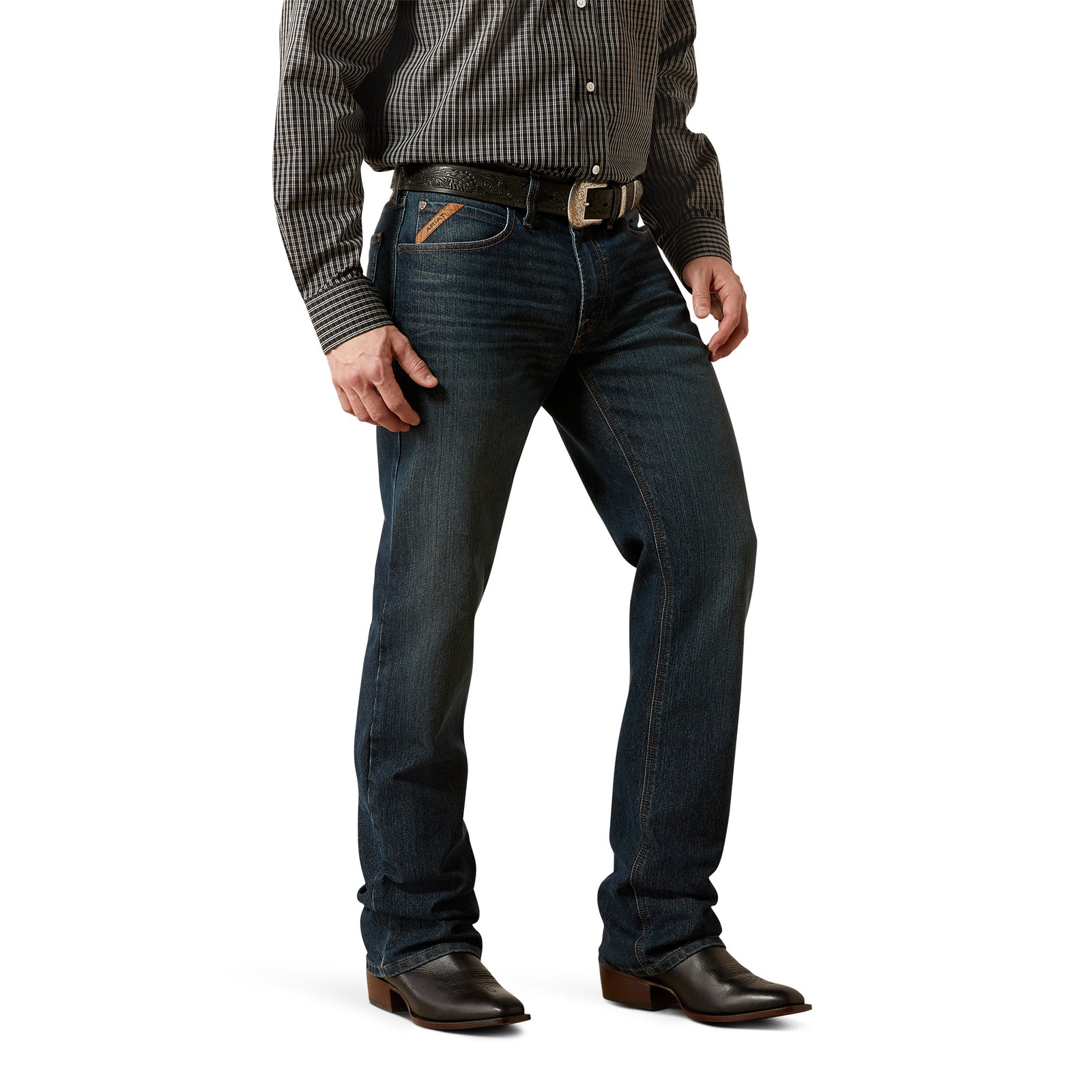 Person wearing dark blue jeans and a checkered shirt on a white background
