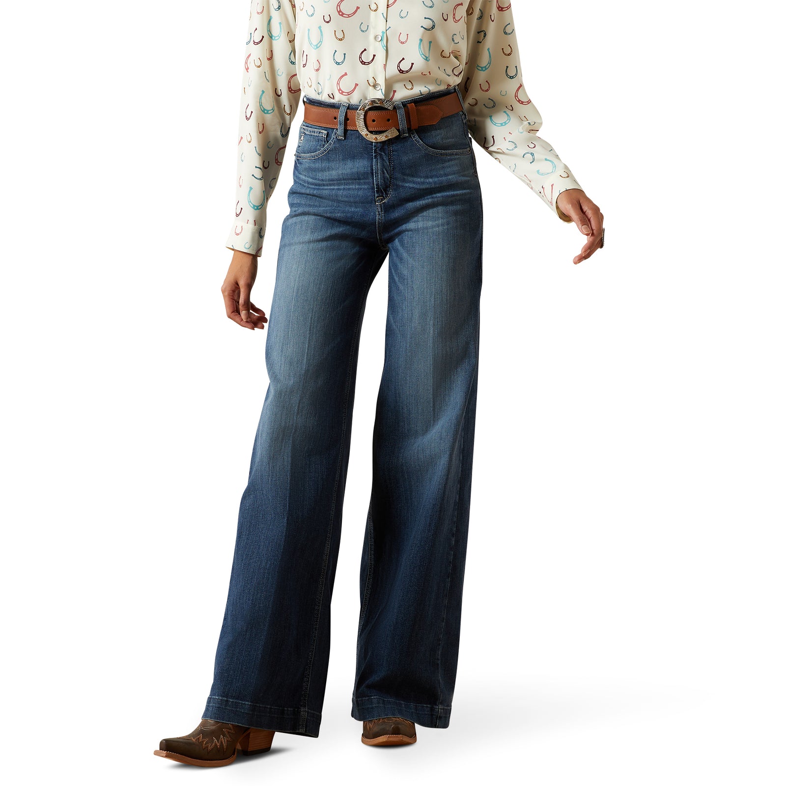 Ariat Women's Rosalie Ultra High Rise Wide Leg Jean. Person wearing blue jeans and a patterned shirt on a white background