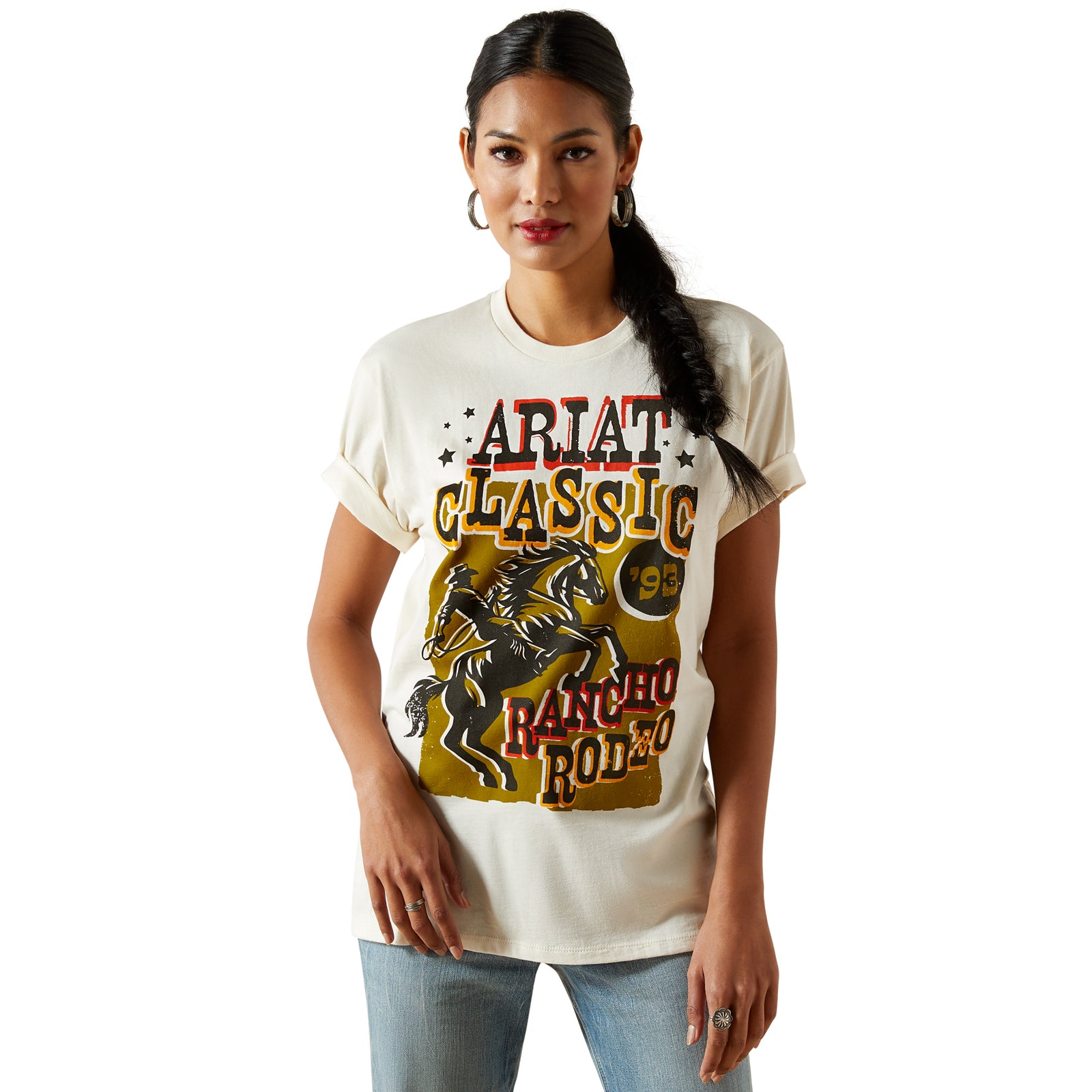 Ariat Women's Classic Rodeo T-Shirt. Woman wearing a t-shirt with 'Ariat Classic' graphic design on a white background