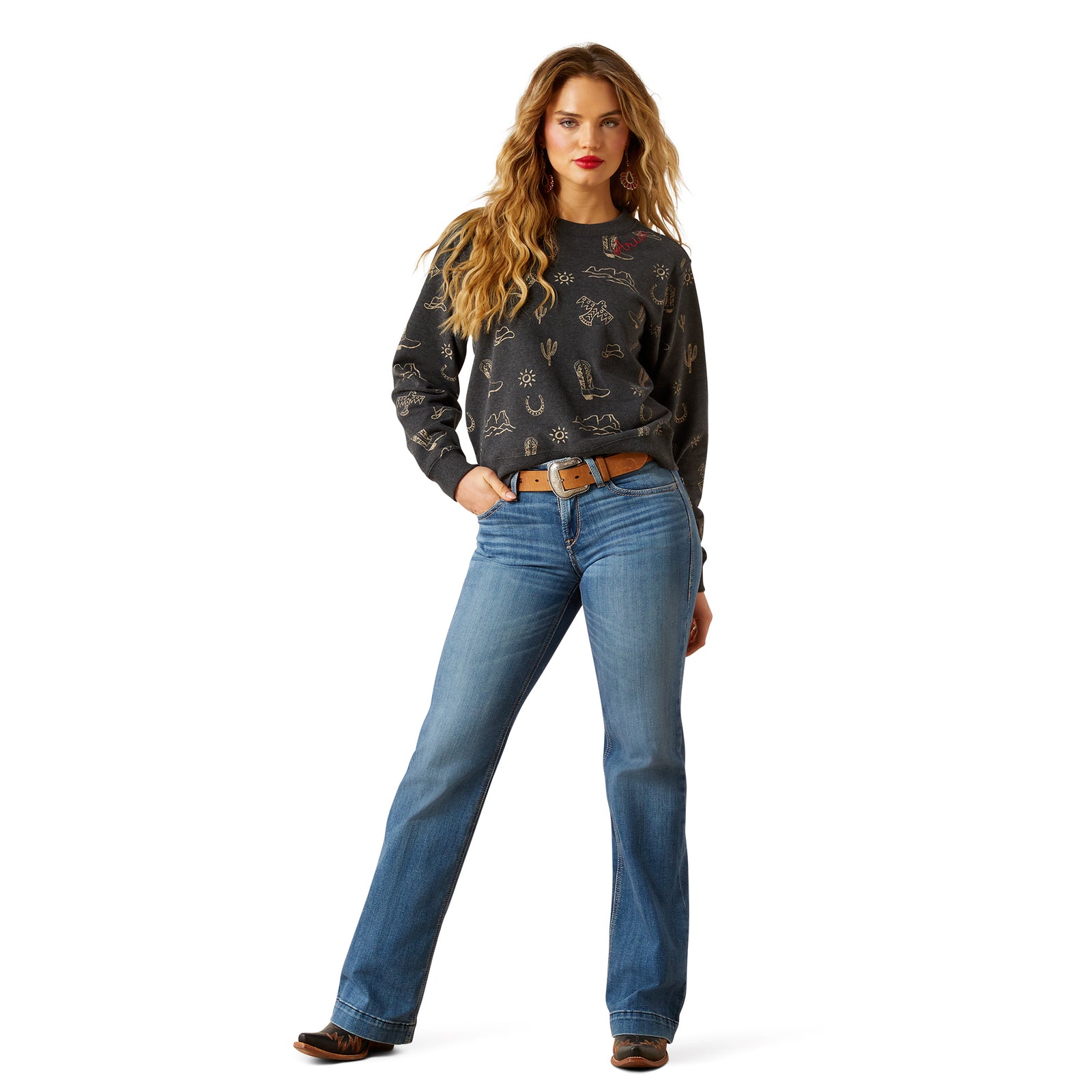 Woman wearing a patterned sweater and blue jeans on a white background