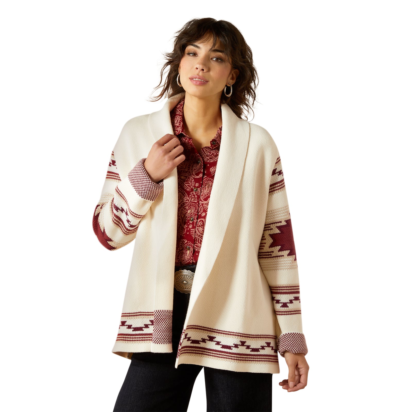 Woman wearing a cream-colored cardigan with red and brown patterns on a white background