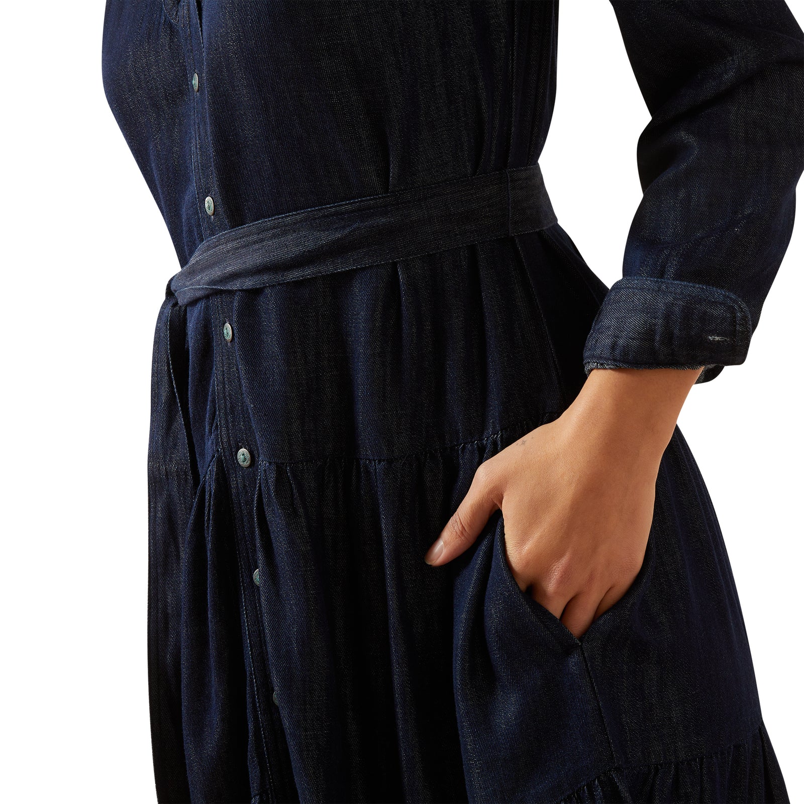 Navy blue dress with a belt and a hand in the pocket on a white background