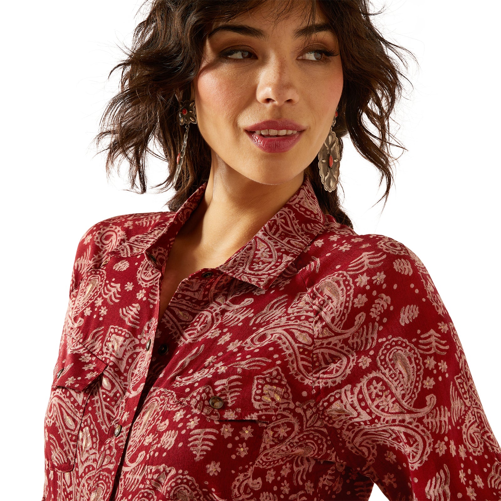 Woman wearing a red patterned shirt on a white background
