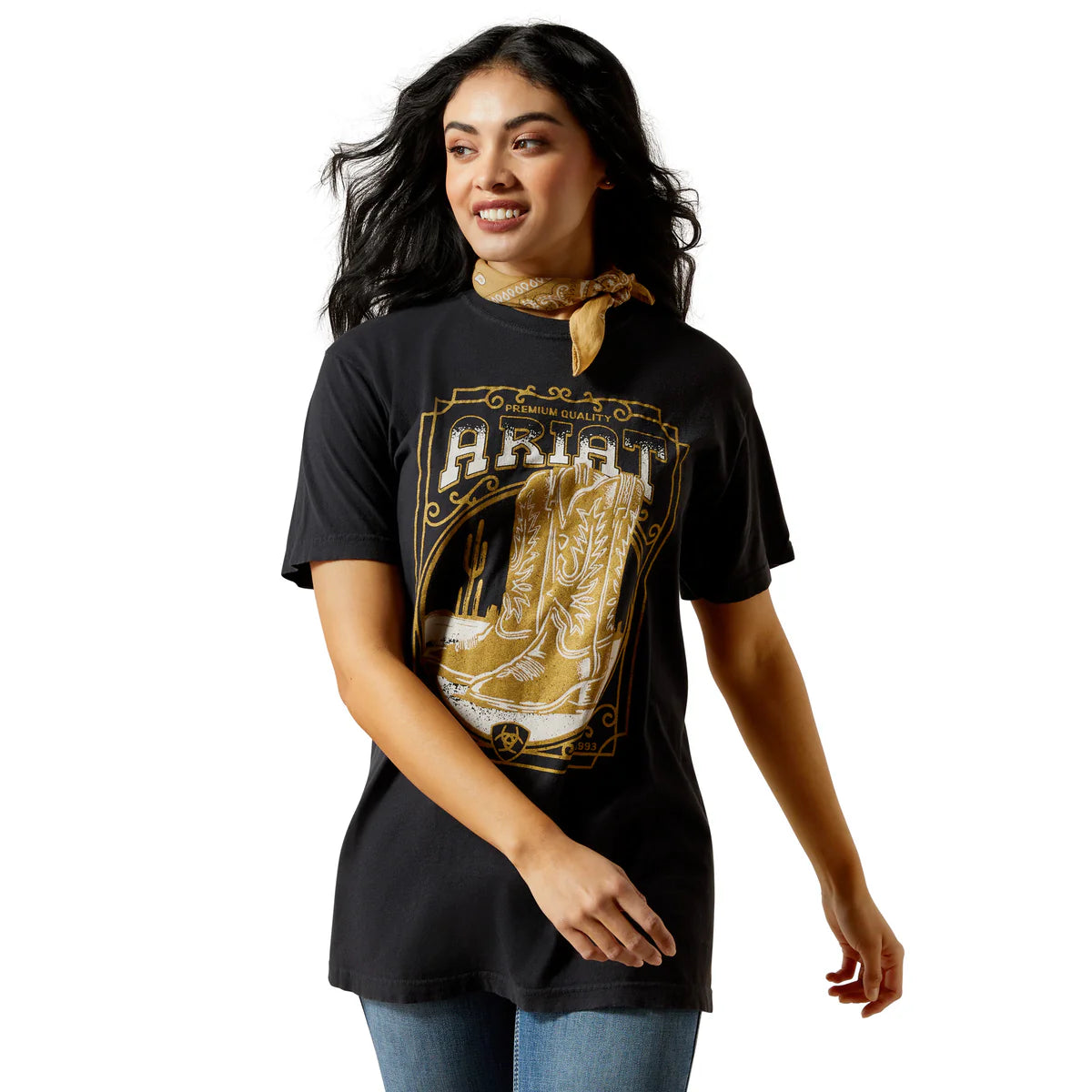 Woman wearing a black t-shirt with a gold graphic design on a white background