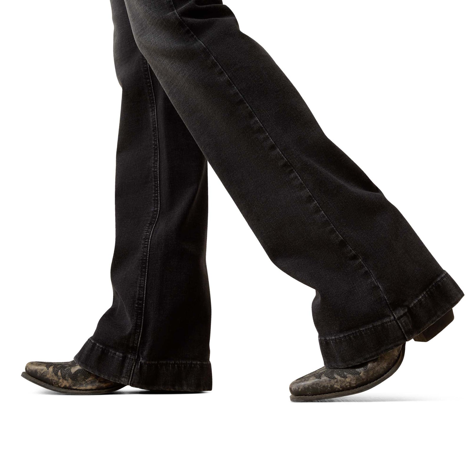 Black jeans and brown boots on a white background