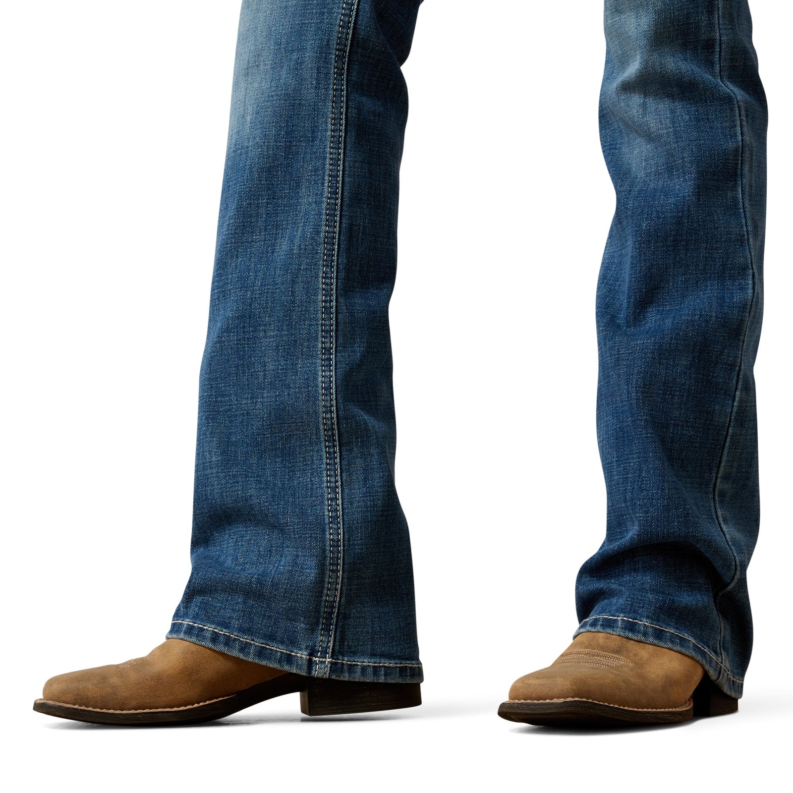 Blue jeans and brown boots on a white background