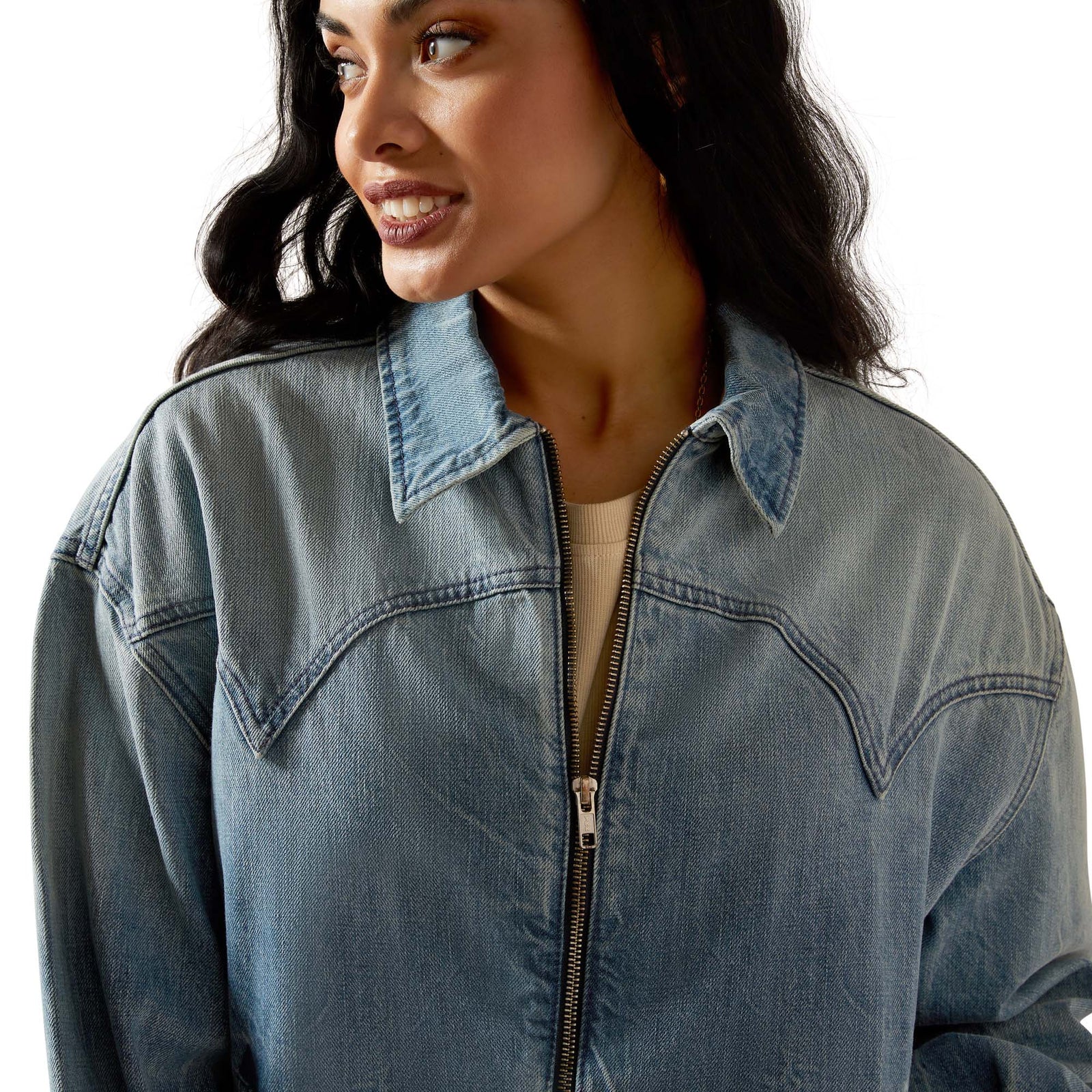 Woman wearing a blue denim jacket on a white background