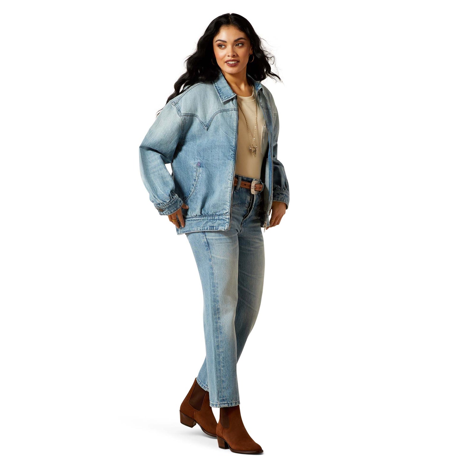 Woman wearing a denim jacket and jeans on a white background