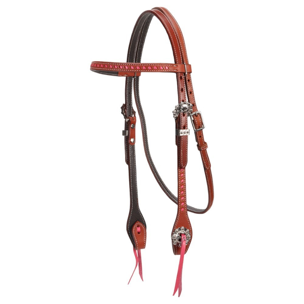 A leather horse headstall and bit set in reddish-brown and dark brown, featuring silver-toned buckles, decorative conchos, and bright pink leather tassels, shown against a plain white background.