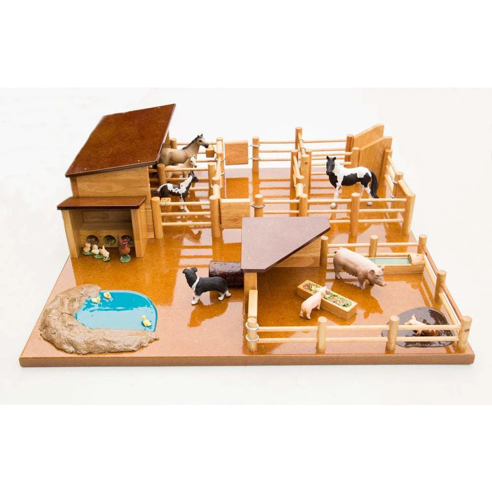 Country Toys FY1 Farm Yard. Hanmade wooden yaerds and stable on a white background.