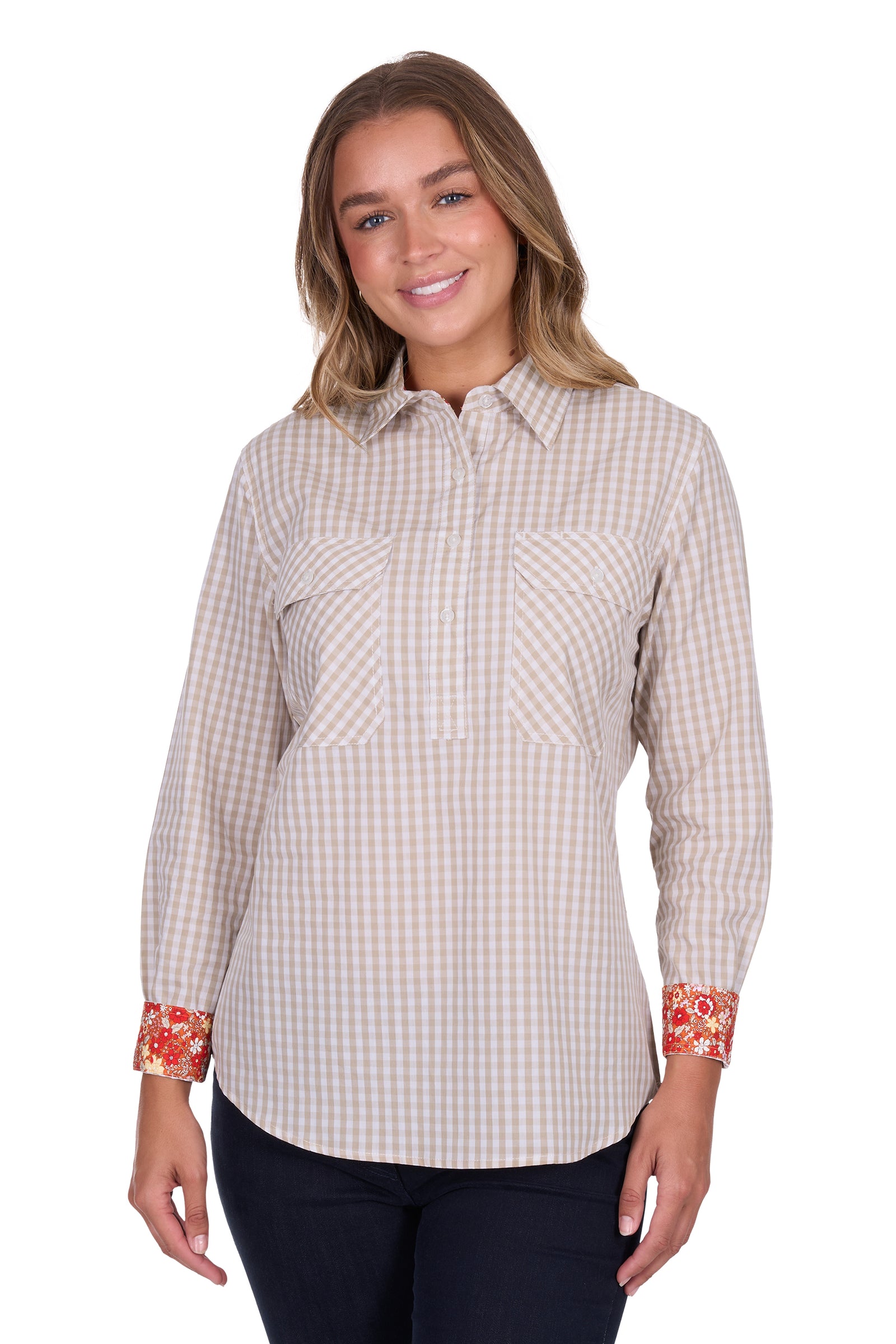Hard Slog Women's Sara 1/2 Placket L/S Shirt. Woman wearing a checkered shirt with floral cuffs on a white background