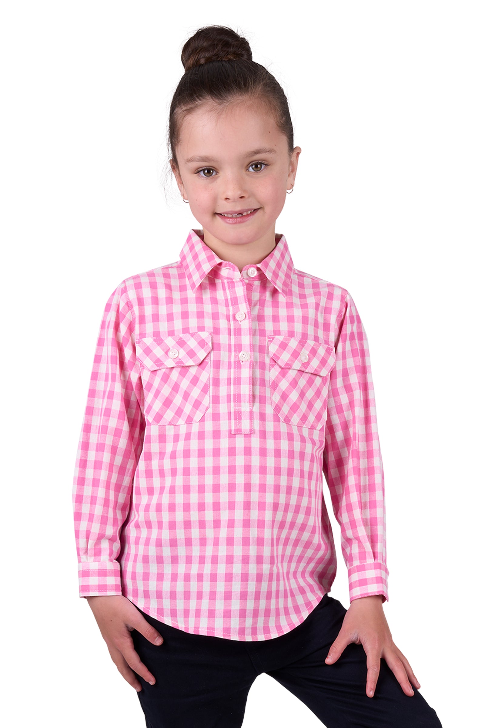 Hard Slog Girl's Melly 1/2 Placket L/S Shirt. A girl wearing a long sleeve pink checkered shirt with a half placket and two front pockets.