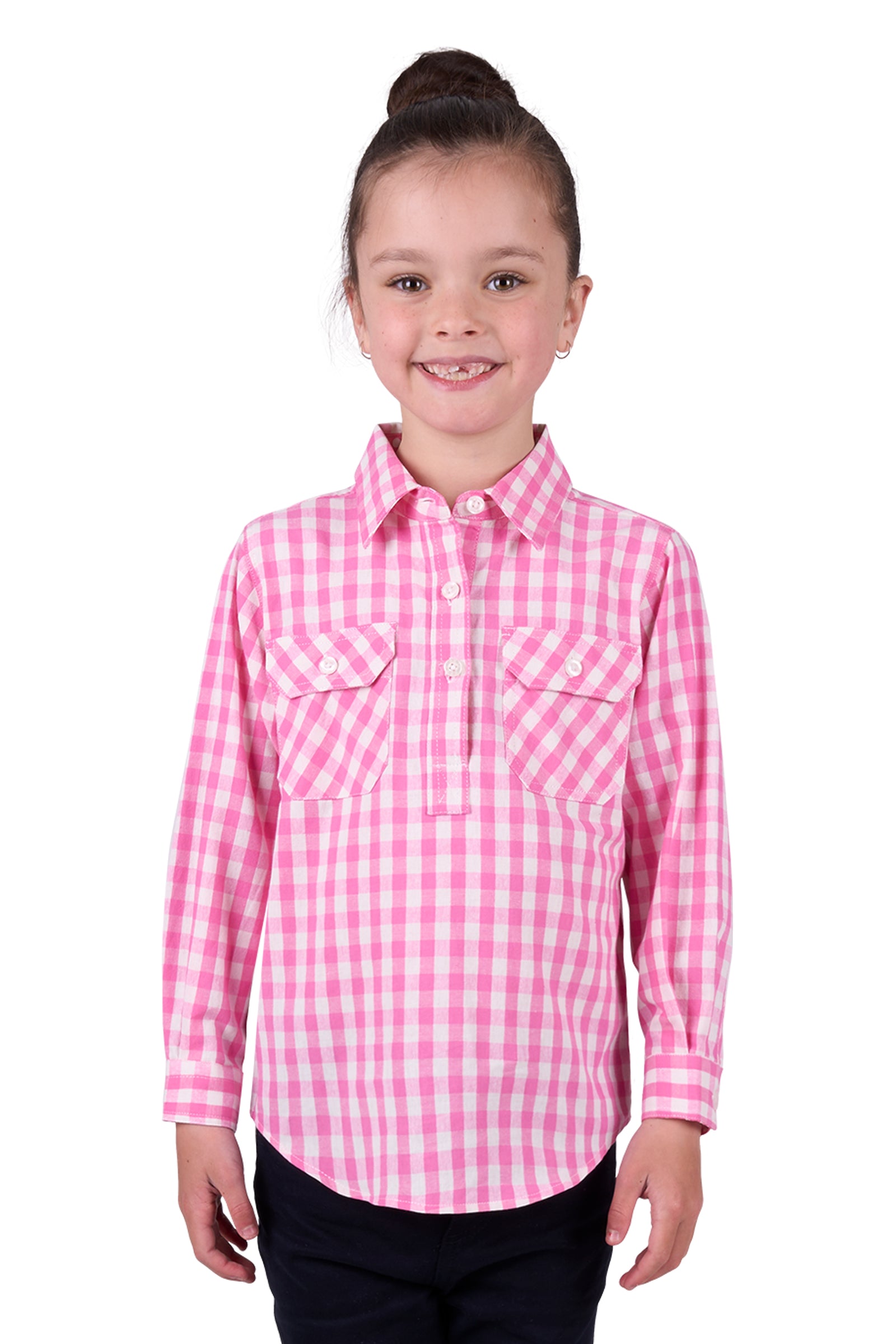 Hard Slog Girl's Melly 1/2 Placket L/S Shirt. A girl wearing a long sleeve pink checkered shirt with a half placket and two front pockets.