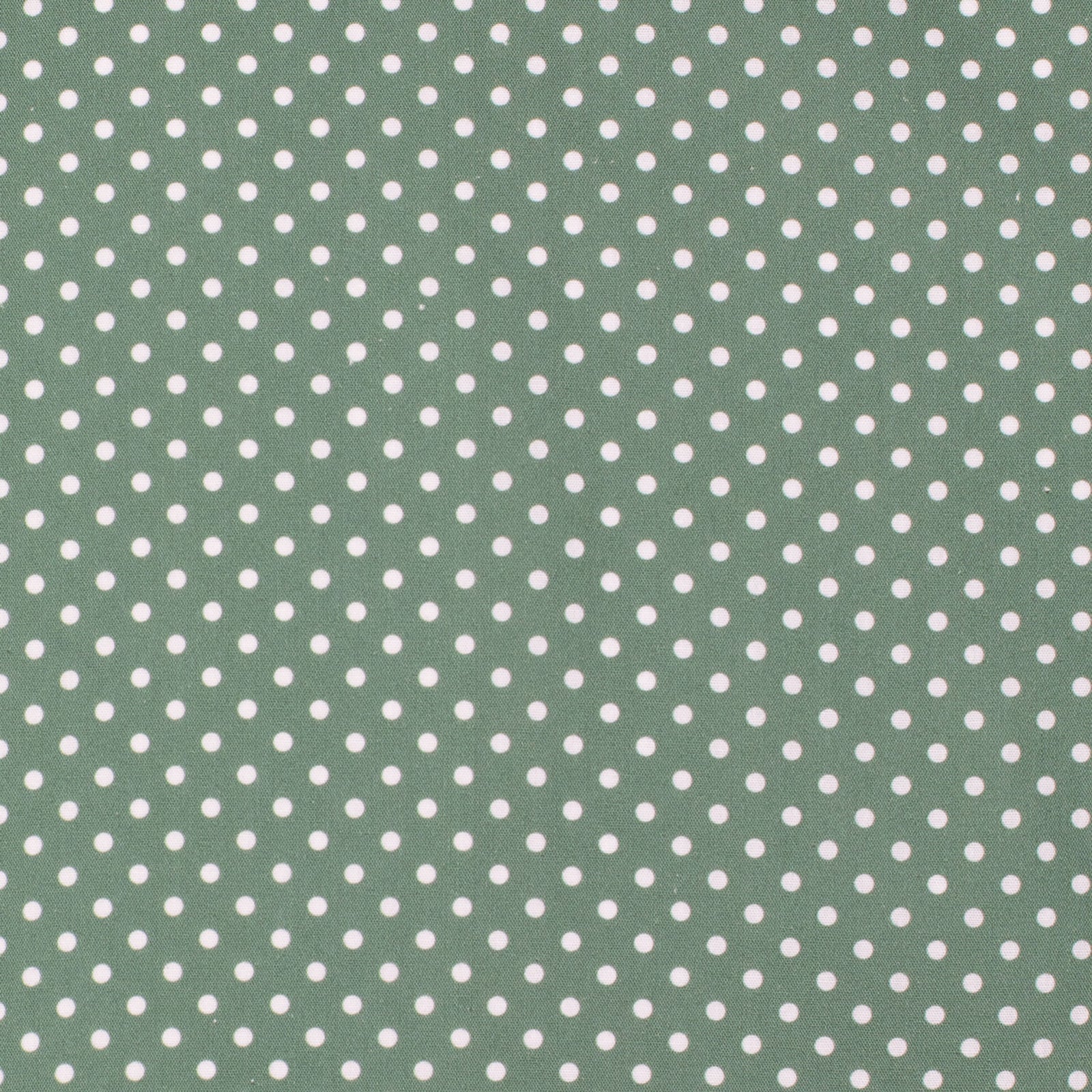 Green fabric with white polka dots