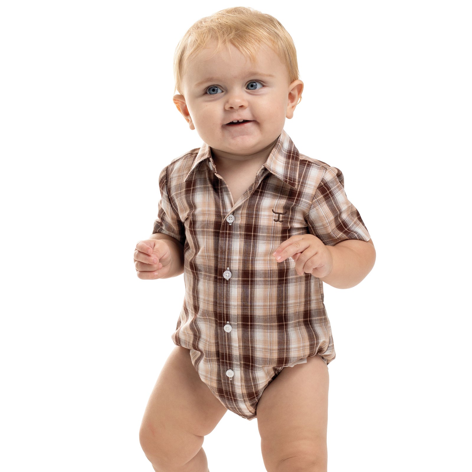 Baby wearing a brown plaid onesie on a white background