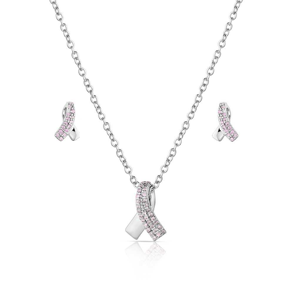 Montana Silversmiths Hope & Strength Ribbon Jewellry Set. A jewelry set including a silver tone necklace with a pink ribbon design pendant and a pair of matching earrings, all coated in pink cubic zirconia crystals.