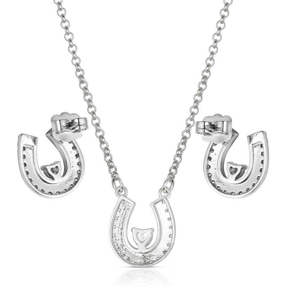 Montana Silversmith the Lovely and Lucky Horseshoe Jewelry Set features a beautifully detailed horseshoe pendant on a split chain, adorned with cubic zirconia crystals that encircle the shoe and a beaded edge with black antiquing along the inside.