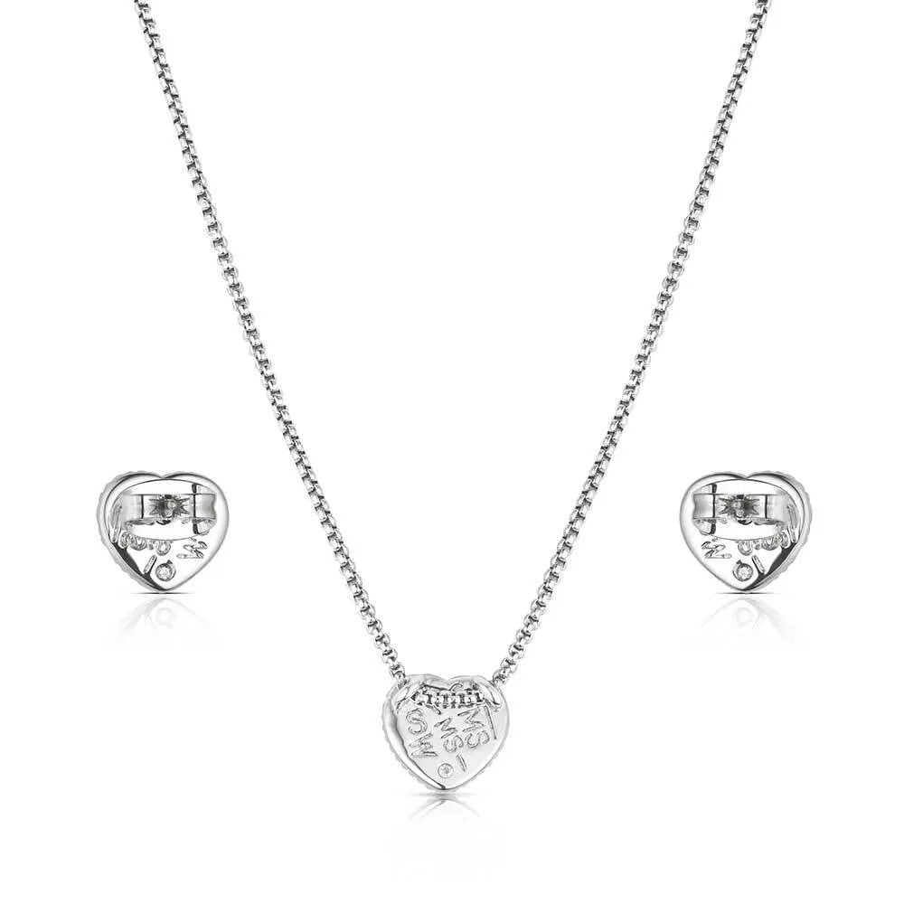 Silver heart-shaped necklace and earrings on a white background