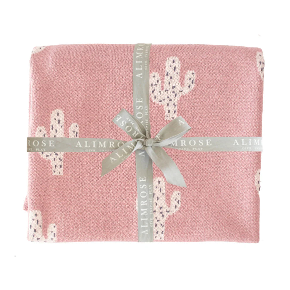 Alimrose Cactus Baby Blanket Petal. Pink blanket with cactus pattern and ALIMROSE ribbon on a white background