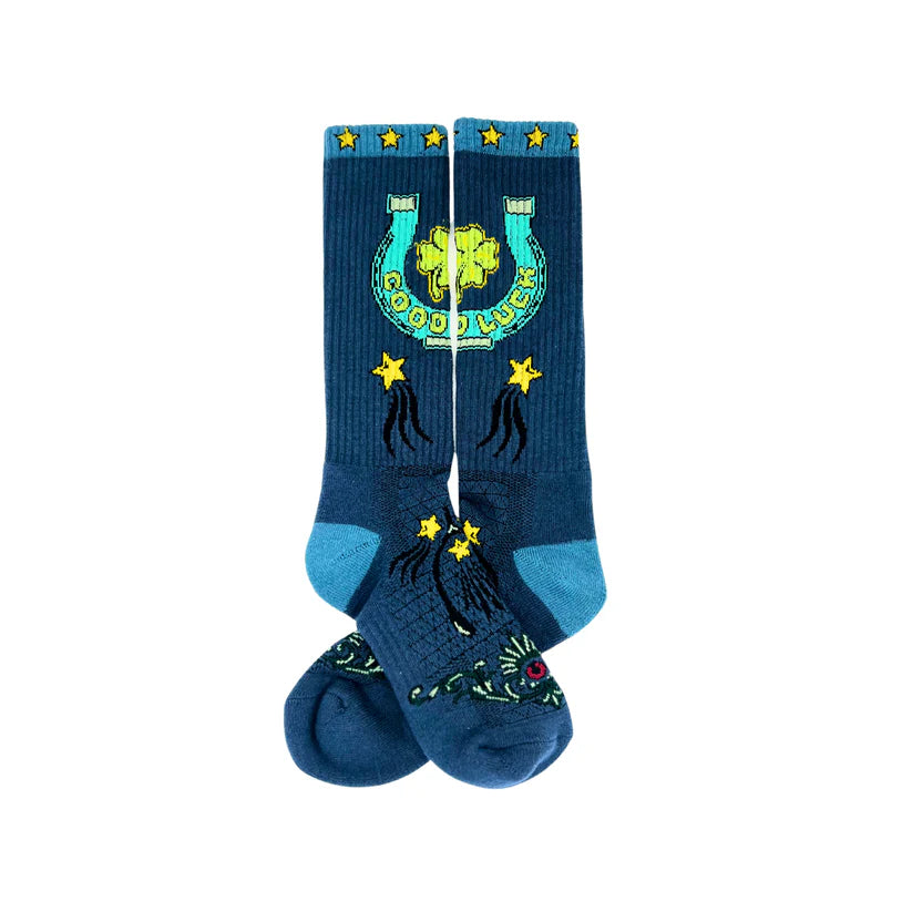 Lucky Chuck Fringe Lucky Horseshoe Performance Socks. Blue socks with lucky charm design on a white background
