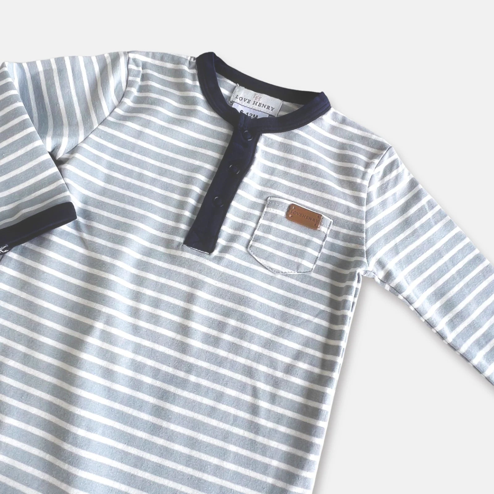 Love Henry Baby Boy's Winter Onesie. Striped onesie with a pocket on a white background