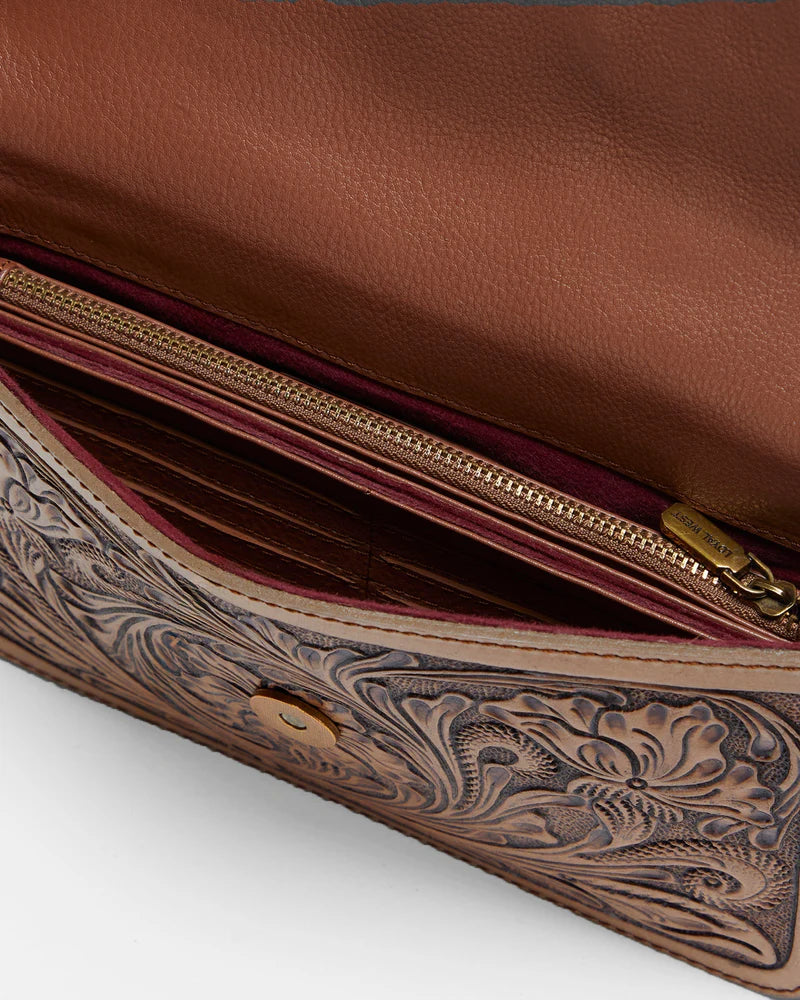 Loyal West The On The Go Mini Chain Bag. Brown leather wallet with intricate embossed design on a white background