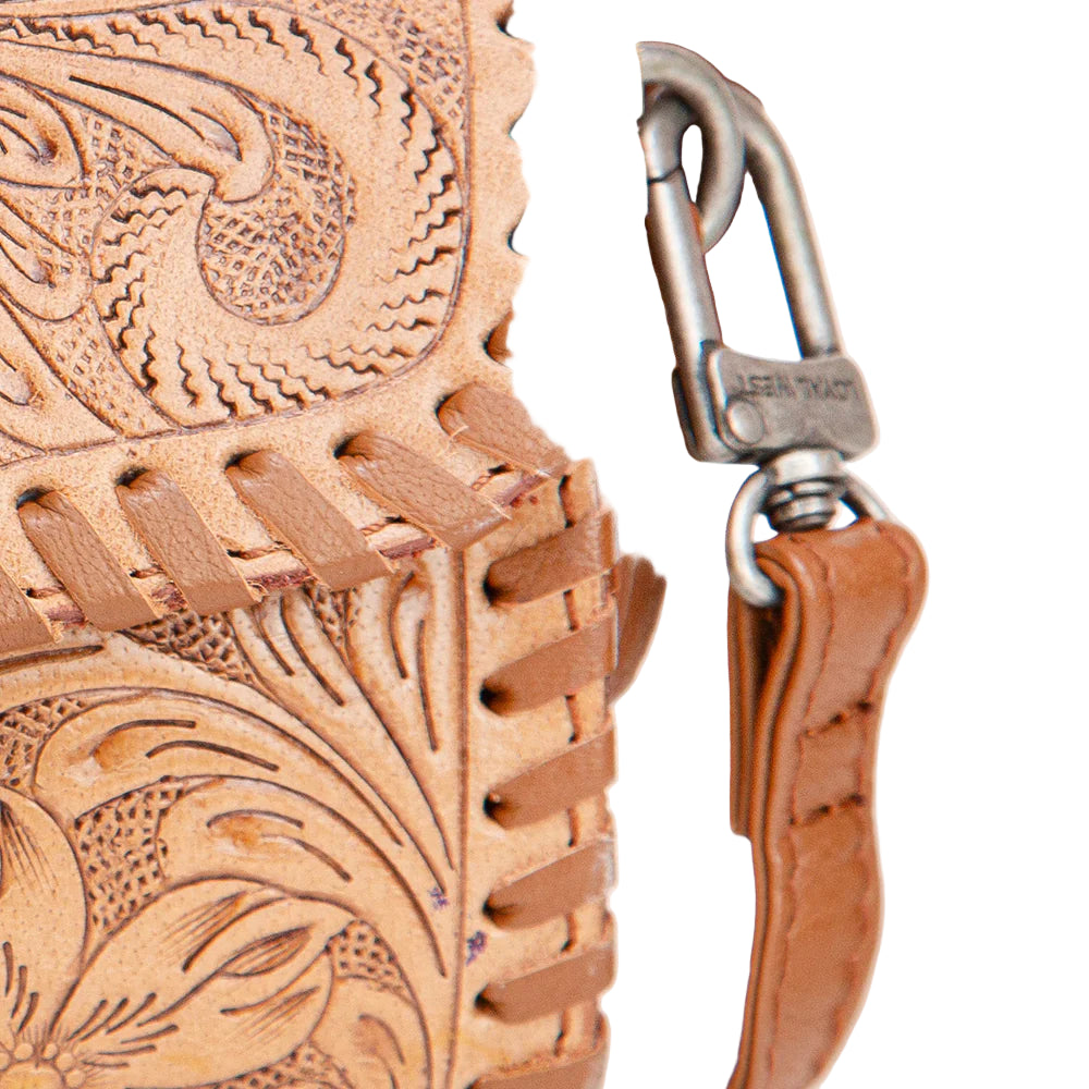 Loyal West Palomino Mini Western Purse. Close-up of a brown leather dog collar with intricate patterns and a metal clasp on a white background.