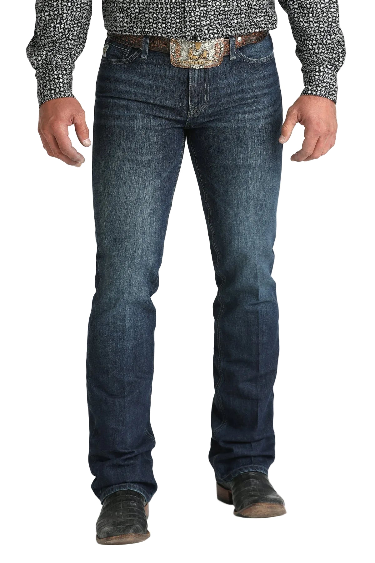 Cinch Men's Ian Dark Wash Slim Fit Jeans. Person wearing blue jeans and a patterned shirt on a white background