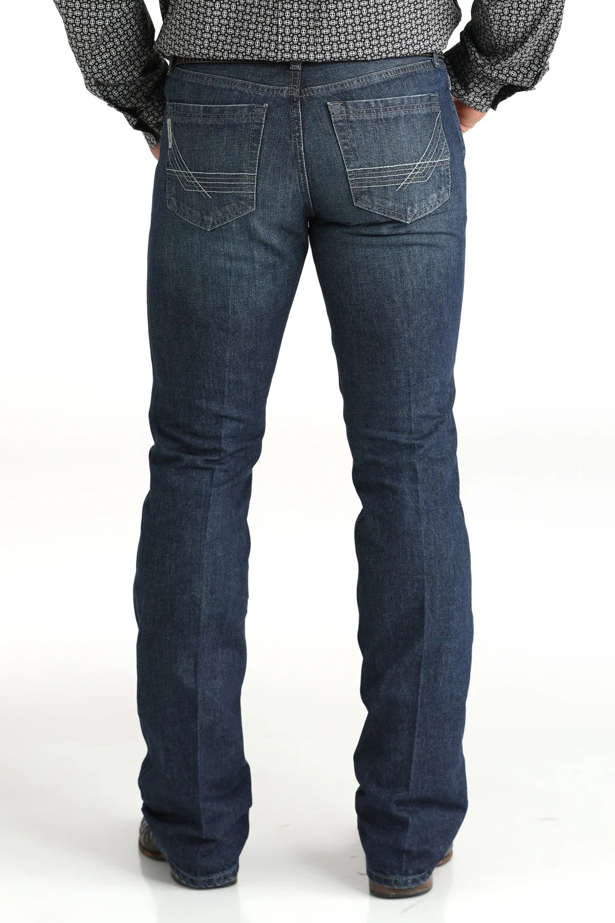 Cinch Men's Ian Dark Wash Slim Fit Jeans. Person wearing blue jeans on a white background