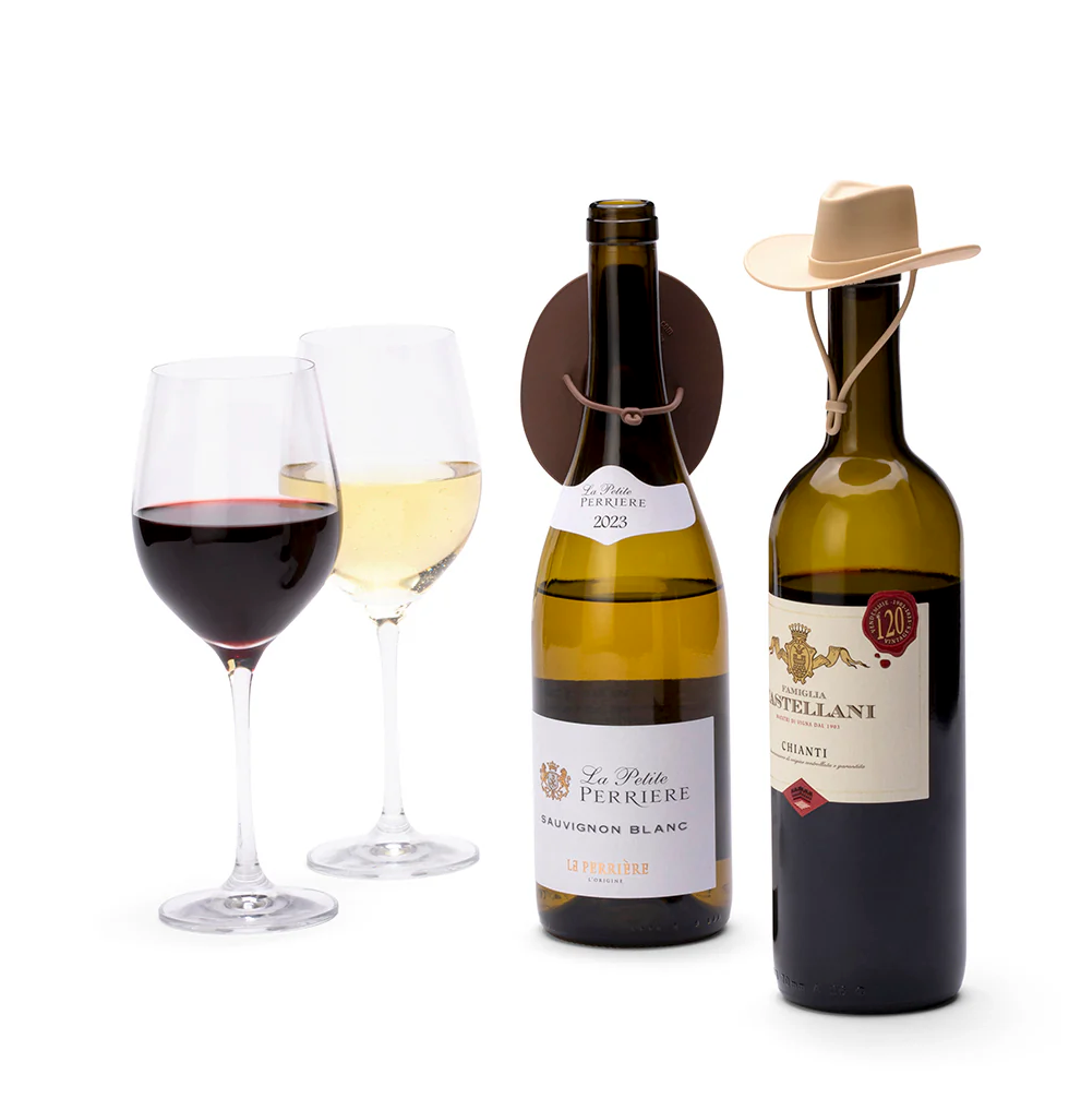 Monkey Business Howdy Bottle Stopper Set 2. Two wine bottles with labels and two wine glasses on a white background