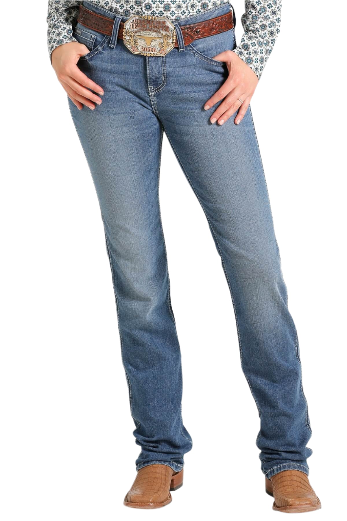 Cinch Women's Shannon Slim Fit Jean. A pair of women's slim fit jeans with a moderate rise, featuring a western style with detailing such as whiskers, chevrons, and tacking.