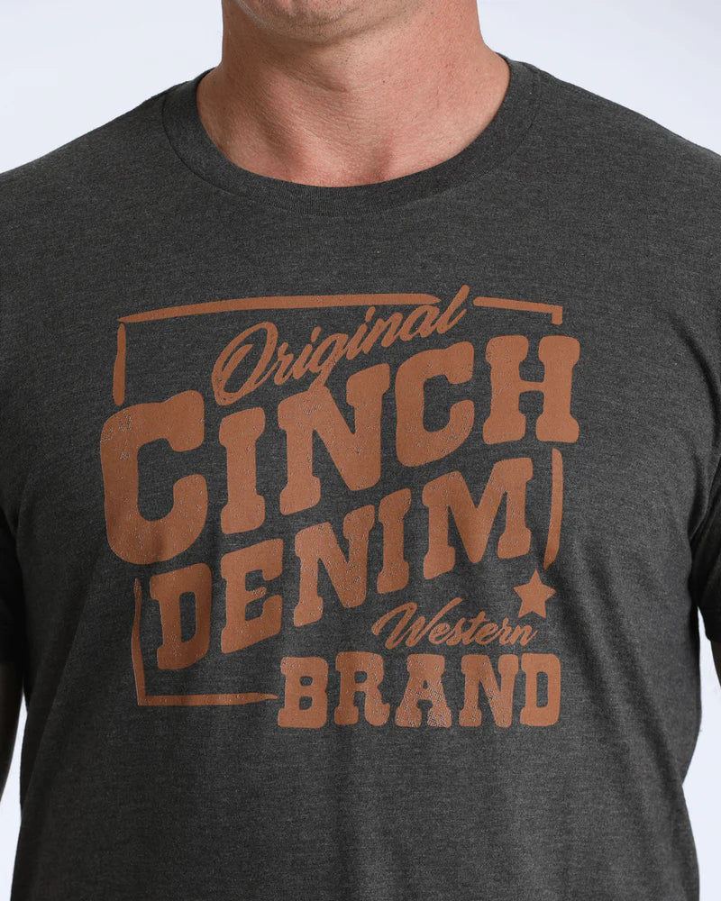 Dark gray t-shirt with 'Original Cinch Denim Western Brand' text in brown on a plain background
