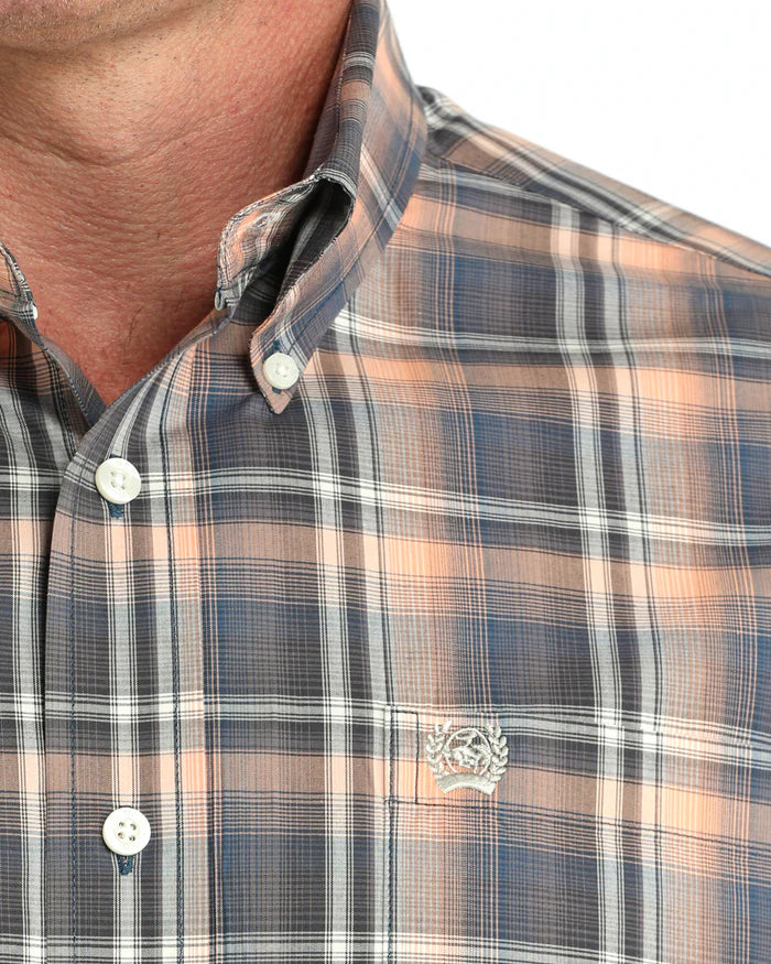 Cinch Men's Classic Fit Check L/S Western Shirt. Close-up of a plaid shirt with a brand logo on a neutral background