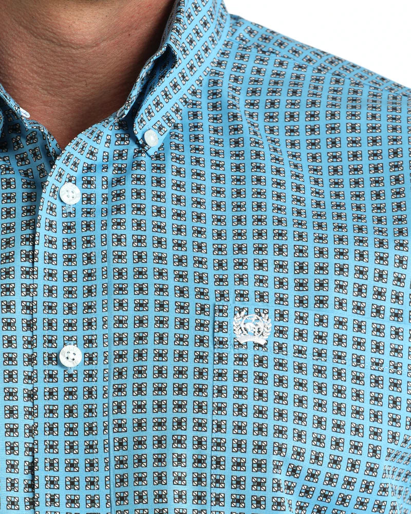 Close-up of a blue patterned shirt with buttons