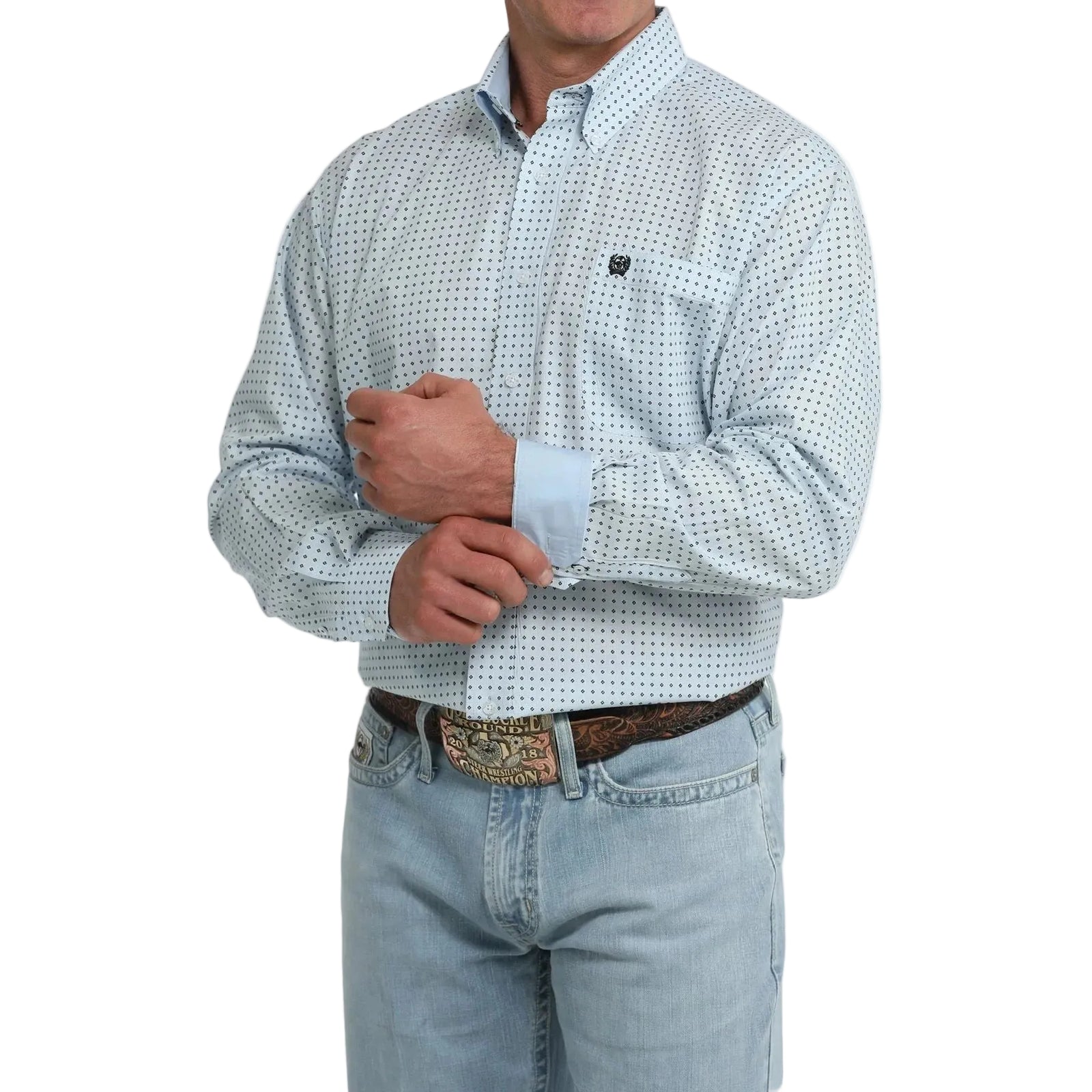 A man wearing a light blue and white micro-patterned long-sleeve button-down shirt with light-wash jeans and a western belt, shown from the chin down on a white background.