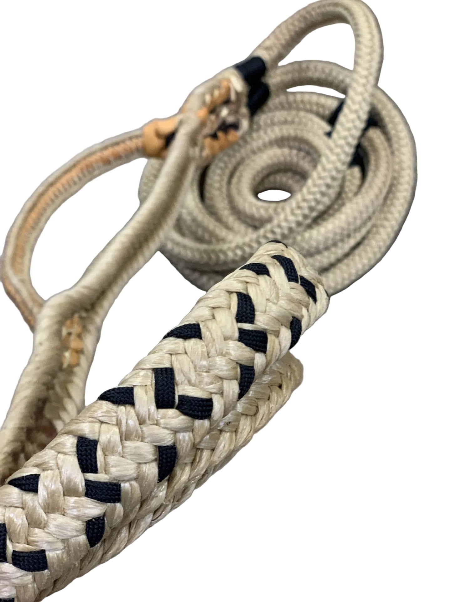 Coiled rope with braided handle on a gray surface